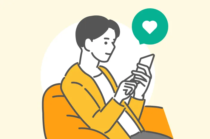 ソファに座ってスマートフォンを操作する男性のイラスト。ハートの吹き出し付き。
